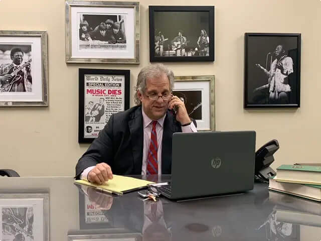 John Price in office taking a phone call